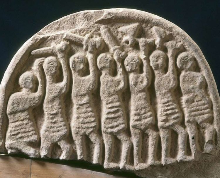 Image: The Doomsday Stone from Lindisfarne Priory. One side depicts invaders, the other has a symbolic depiction of Domesday. This relic is evidence of the continued Christian community at Lindisfarne despite a brutal Viking raid © Historic England