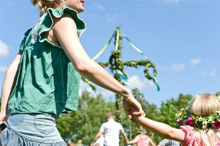 People dancing around a maypole